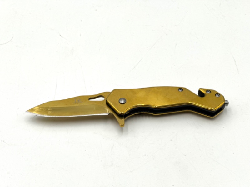 Photo 1 of GOLD FALCON POCKET KNIFE WITH SEAT BELT CUTTER AND WINDOW BREAKER NEW