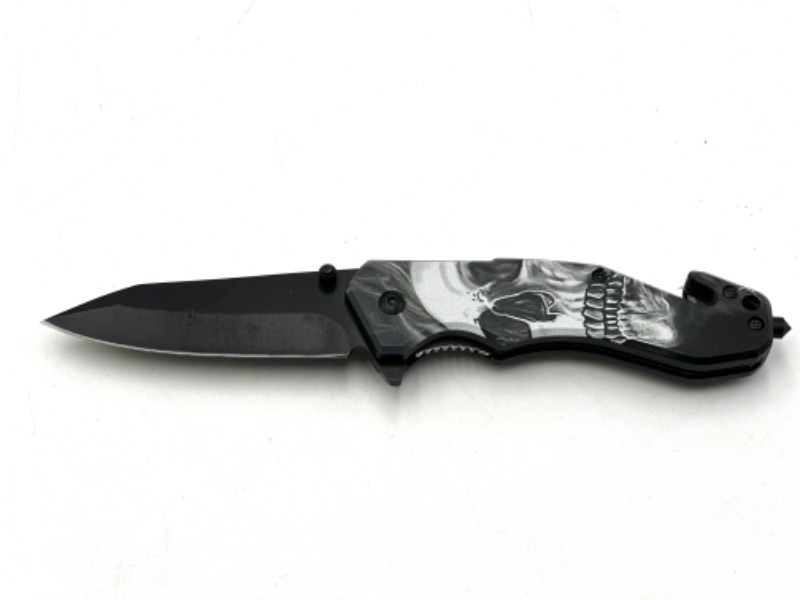 Photo 1 of SKULL DESIGN POCKET KNIFE WITH WINDOW BREAKER AND SEAT BELT CUTTER NEW