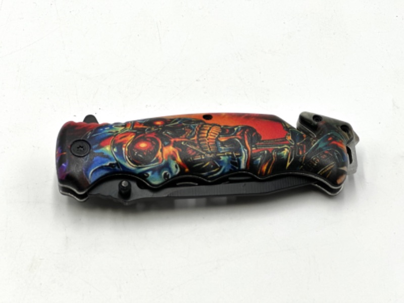 Photo 2 of COLORFUL ROBOT SKULL POCKET KNIFE WITH WINDOW BREAKER AND SEATBELT CUTTER NEW