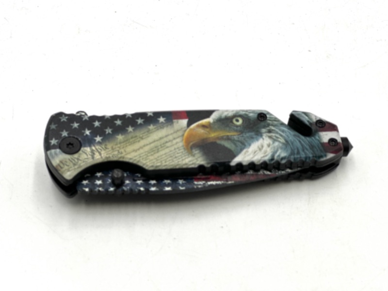 Photo 2 of WE THE PEOPLE USA EAGLE POCKET KNIFE WITH WINDOW BREAKER AND SEAT BELT CUTTER NEW 