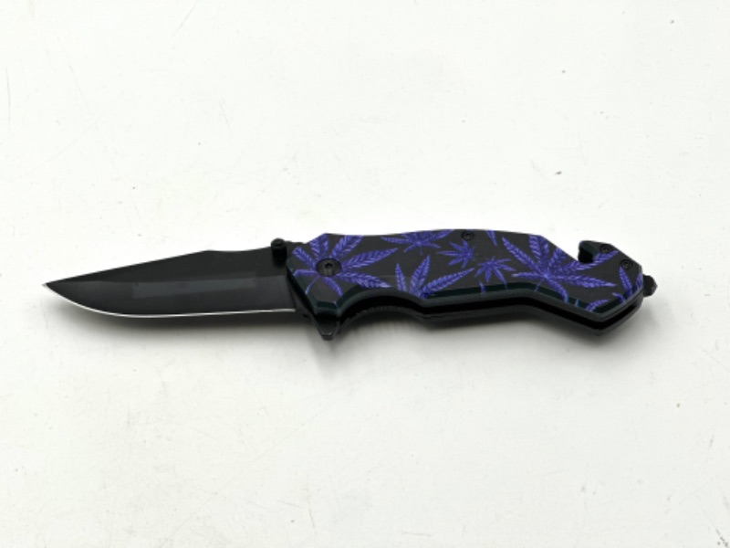 Photo 1 of PURPLE HEMP FLOWER DESIGN POCKET KNIFE WITH WINDOW BREAKER AND POCKET KNIFE NEW