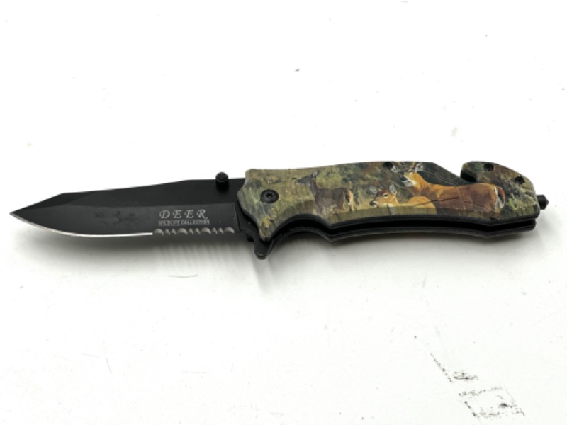 Photo 1 of CAMO PRINT DEER DESIGN POCKET KNIFE WITH WINDOW BREAKER AND SEAT BELT CUTTER NEW