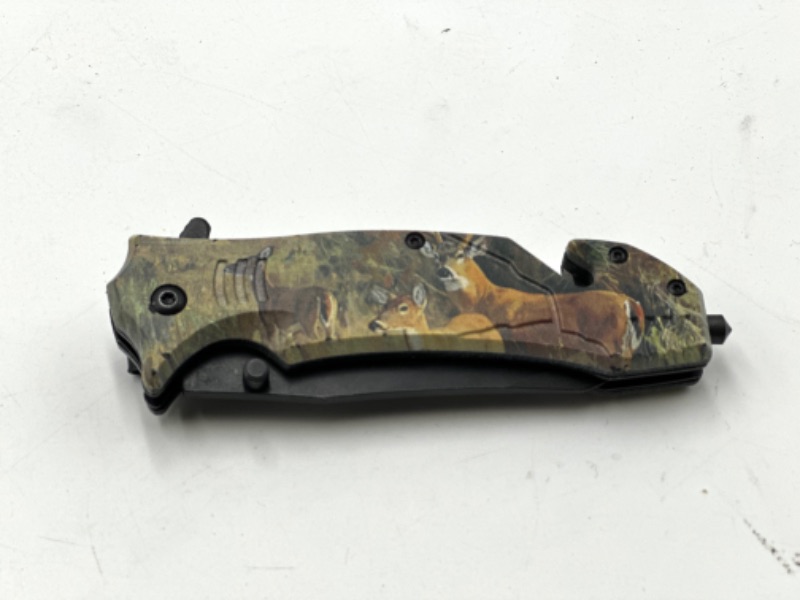 Photo 2 of CAMO PRINT DEER DESIGN POCKET KNIFE WITH WINDOW BREAKER AND SEAT BELT CUTTER NEW