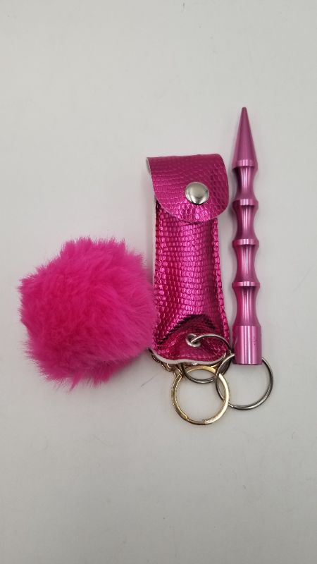 Photo 1 of PINK SAFETY KEY SET 1 PUFFBALL 1 PEPPER SPRAY AND 1 WINDOW BREAKER NEW