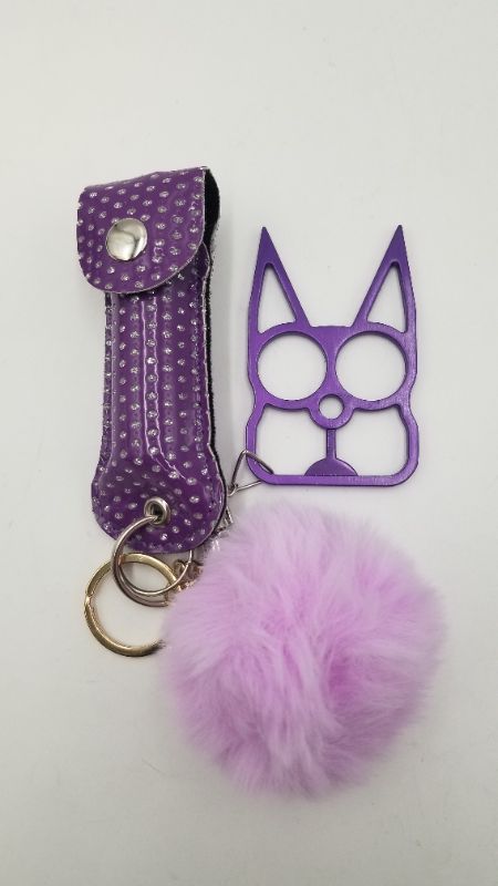Photo 1 of PURPLE SAFETY KEY SET 1 PUFFBALL 1 PEPPER SPRAY AND 1 WINDOW BREAKER NEW
