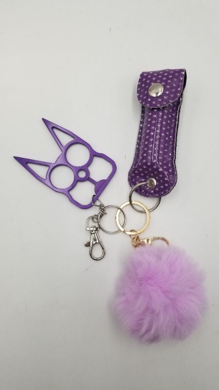 Photo 2 of PURPLE SAFETY KEY SET 1 PUFFBALL 1 PEPPER SPRAY AND 1 WINDOW BREAKER NEW