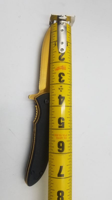 Photo 2 of GOLD AND BLACK POCKET KNIFE NEW 