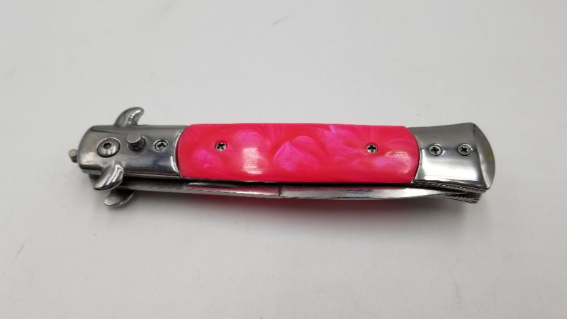 Photo 2 of 3.5 INCH STILETTO PINK POCKET KNIFE WITH SAFETY SWITCH NEW 
