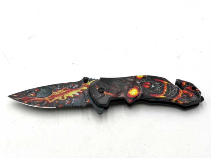 Photo 1 of FIRE SKULL DESIGN POCKET KNIFE WITH WINDOW BREAKER AND SEAT BELT CUTTER NEW