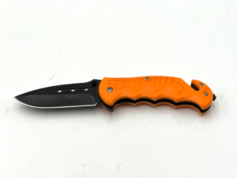 Photo 1 of ORANGE POCKET KNIFE WITH WINDOW BREAKER AND SEAT BELT CUTTER NEW
