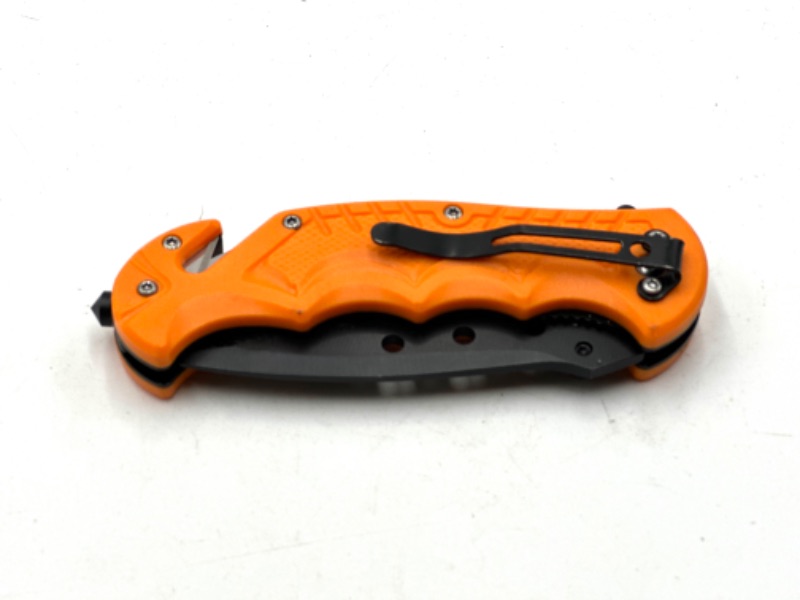 Photo 3 of ORANGE POCKET KNIFE WITH WINDOW BREAKER AND SEAT BELT CUTTER NEW