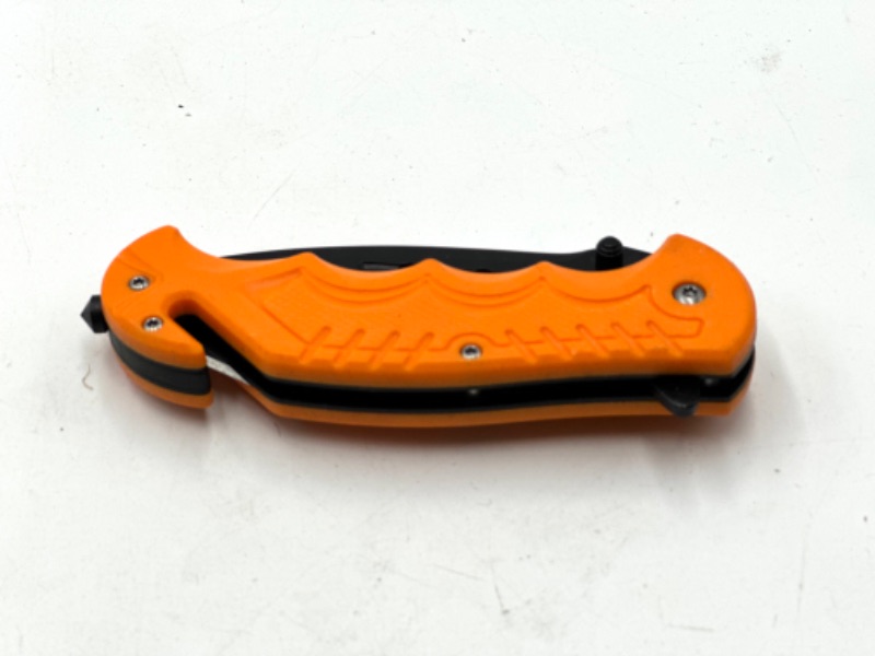 Photo 2 of ORANGE POCKET KNIFE WITH WINDOW BREAKER AND SEAT BELT CUTTER NEW