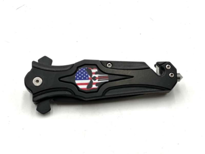 Photo 2 of BLACK SKULL USA FLAG DESIGN POCKET KNIFE WITH WINDOW BREAKER AND SEAT BELT CUTTER NEW