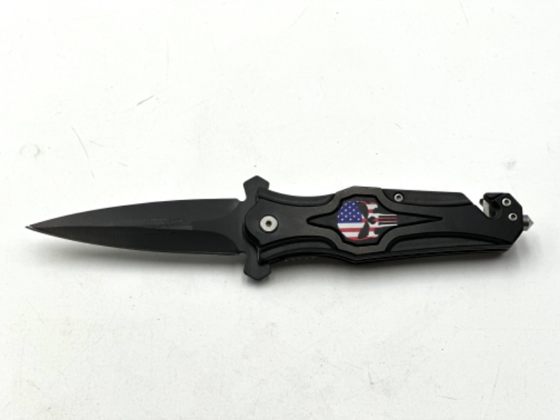 Photo 1 of BLACK SKULL USA FLAG DESIGN POCKET KNIFE WITH WINDOW BREAKER AND SEAT BELT CUTTER NEW