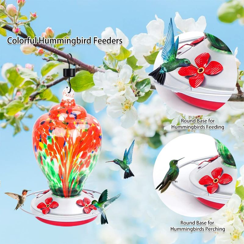 Photo 2 of Hummingbird Feeders for Outdoors, 28 Ounces Hand Blown Glass Hummingbird Feeder with Upgraded Leak Proof Round Metal Stand, Wild Bird Feeder for Outside Garden Yard. Ant Moat, Hook and Brush Included