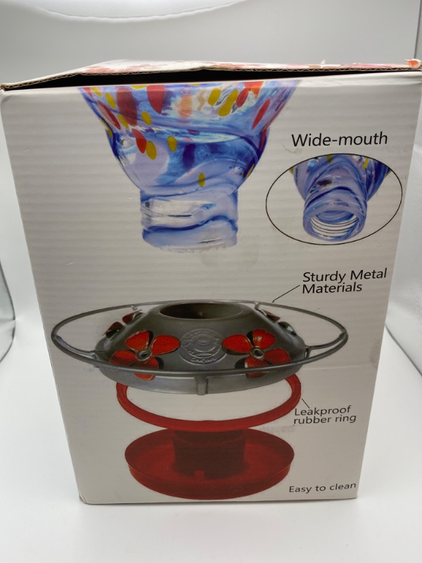 Photo 4 of Hummingbird Feeders for Outdoors, 28 Ounces Hand Blown Glass Hummingbird Feeder with Upgraded Leak Proof Round Metal Stand, Wild Bird Feeder for Outside Garden Yard. Ant Moat, Hook and Brush Included