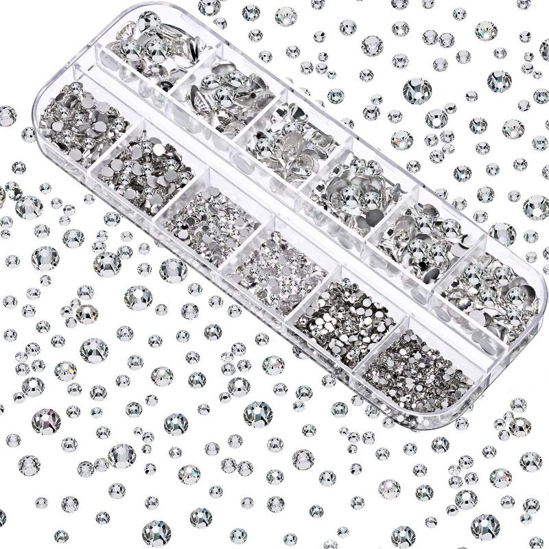 Photo 1 of Dowarm 2650 Pieces Glue Fix Glass Flat Back Crystal Rhinestones, 6 Sizes 1.5mm 2mm 2.8mm 4mm 4.8mm 6.5mm, White Flatback Crystals Loose Gemstones for Crafts Nail Face Art Jewels (Crystal Clear)