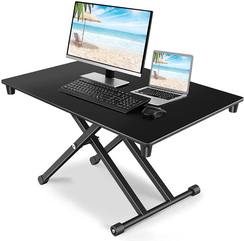 Photo 1 of Standing Desk Converter Height Adjustable,JUSTSTONE Height Adjustable Stand Up Desk Converter 28 Inch Desk Riser Workstation Sit to Stand in Seconds for Laptop & Computer Home and Office Dual Monitors

