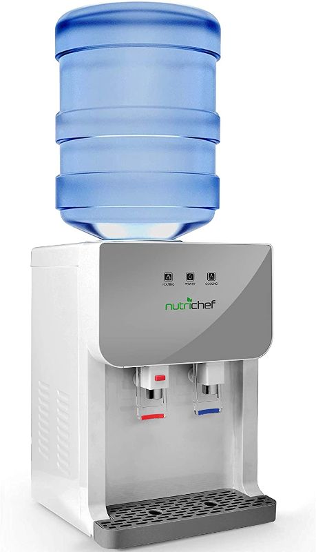 Photo 1 of NutriChef Top Loading Compact Mini Desktop/Countertop Water Cooler Dispenser Hot and Cold w/Thermoelectric Cooling, Child Safety Lock, for 3 or 5 Gallon Bottle/Jug PKTWC36SL, Gray
