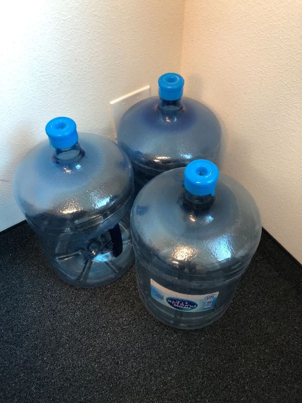 Photo 1 of 3 large 5 gallon water jugs sold as is 