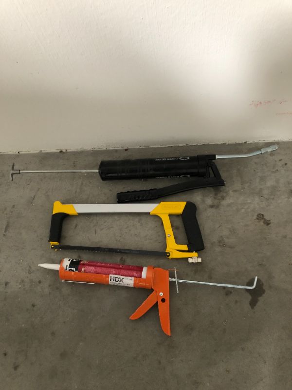 Photo 1 of 3 piece misc tool lot glue guns and hand saw