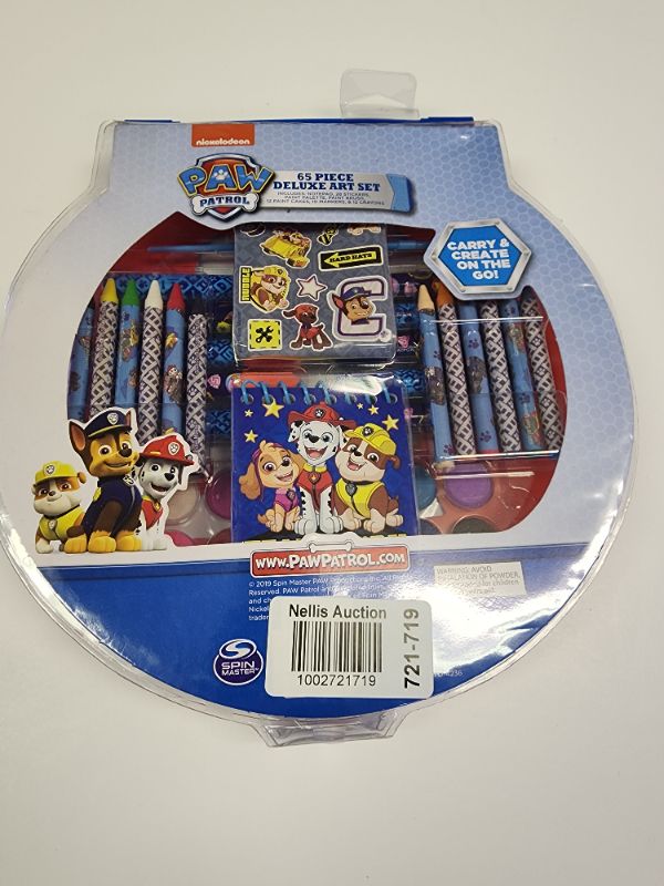Photo 2 of Paw Patrol 65 Pieces Deluxe Set. Includes: notepads, 28 stickers, paint palette, paint brush, 12 paint cakes, 10 markers & 12 crayons