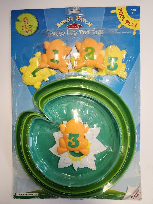 Photo 1 of Melissa & Doug Sunny Patch Froggy Lily Pad Toss. This exciting set challenges young swimmers to toss six colorful frogs onto three plastic lily pads. With colors, numbers and sizes to sort and score, there are lots of ways to play and win!