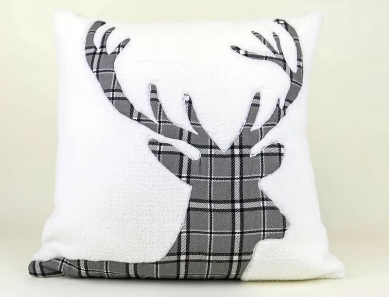 Photo 1 of Macy's holiday pillow from the Martha Stewart Collection at Macy's. The cozy sherpa fleece throw pillow is appliquéd with a plaid stag's head.