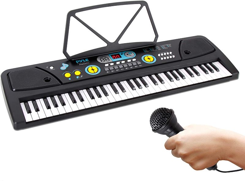 Photo 1 of Digital Piano Kids Keyboard - Portable 61 Key Piano Keyboard, Learning Keyboard for Beginners w/ Drum Pad, Recording, Microphone, Music Sheet Stand, Built-in Speaker - Pyle PKBRD6111 , Black
