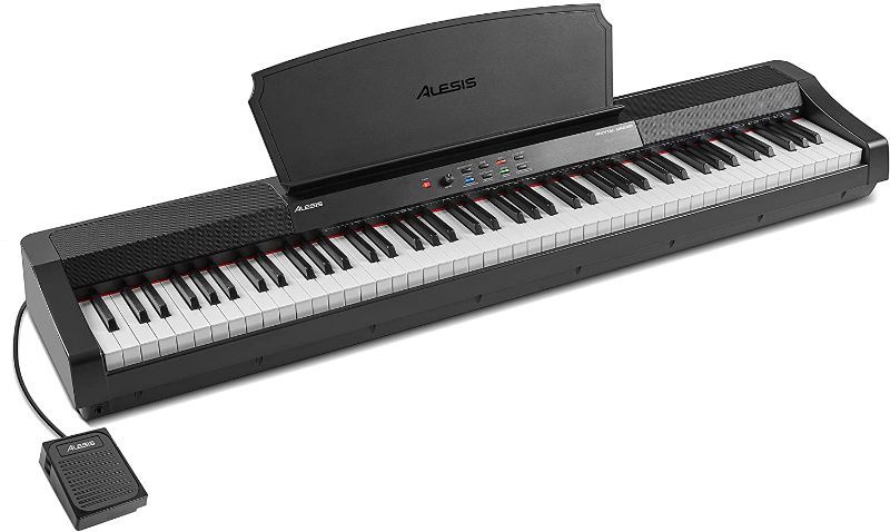Photo 1 of Alesis Recital Grand - 88 Key Digital Piano with Full Size Graded Hammer Action Weighted Keys, Multi-Sampled Sounds, Speakers, FX and 128 Polyphony