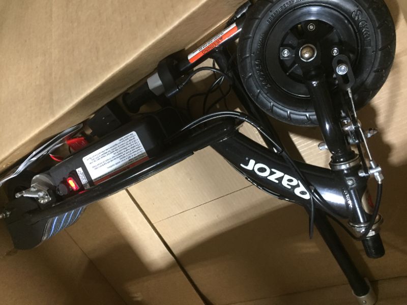 Photo 1 of Razor E100 Glow Electric Scooter for Kids Age 8+, LED Light-Up Deck, 8" Air-filled Front Tire, Up to 40 min Continuous Ride Time