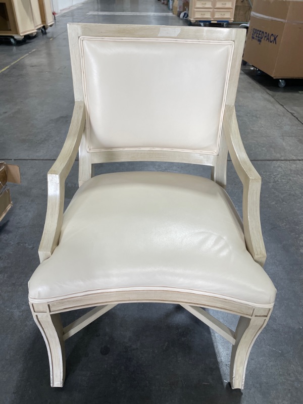 Photo 1 of FAUX LEATHER WHITE DINING CHAIR 21L X 23W X 37H INCHES