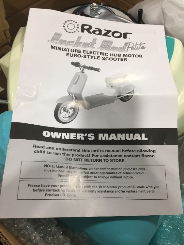 Photo 4 of Razor Pocket Mod Petite - 12V Miniature Euro-Style Electric Scooter for Ages 7 and Up, Hub-Driven Motor, Air-Filled White Wall Tires, Up to 40 min Ride Time, Blue
