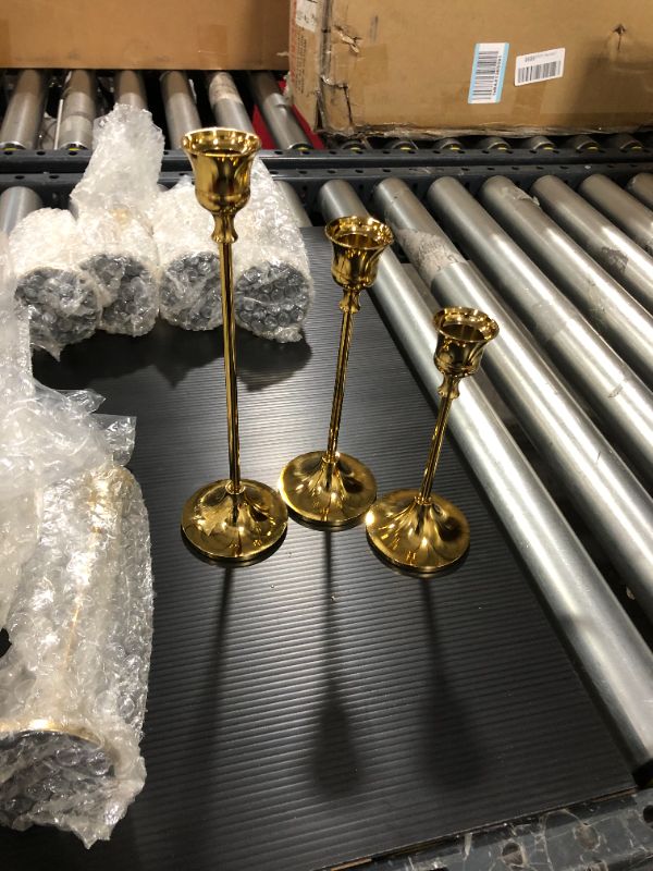 Photo 2 of Anndason Set of 3 Gold Candlestick Holders Gold Candle Holder Taper Candle Holders Candle Holder Decorative Candlestick Holder for Home Decor, Wedding, Dinning, Party, Anniversary 6.1''*2.63''(15.5cm*6.68cm), 7.36''*2.63''(18.7cm*6.68cm), 9.37''*2.63''(23