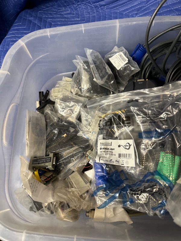 Photo 1 of plastic bin full of cables 