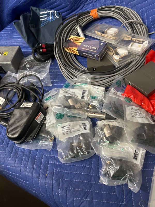 Photo 3 of Plastic tub full of cables and New in packages XLR parts and  clipper foot switch hot service igniters and more 