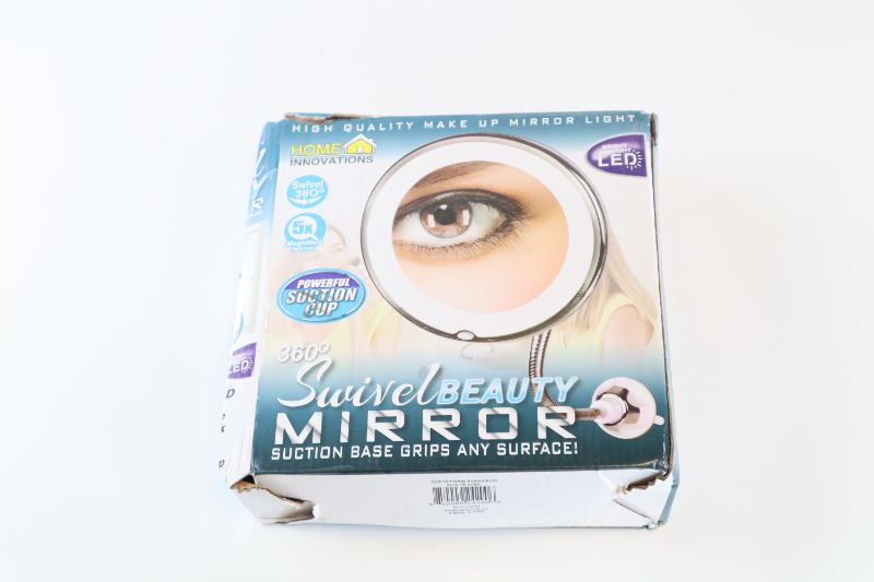 Photo 2 of BEAUTY SWIVEL MIRROR 10X MAGNIFICATION 7IN DIAMETER  360 DEGREE ROTATION BATTERY OPERATED LED BOX IS DAMAGED $19.99