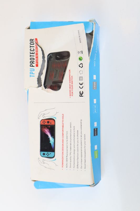 Photo 3 of NINTENDO SWITCH HANDHELD GRIP CASE HEAT DISSIPATION PORTS BUTTONS AND KICKSTAND ACCESS FULL BODY PROTECTION BOX HAS DAMAGED DUE TO SHIPMENT NEW PRODUCT DEVICE NOT INCLUDED $49.99