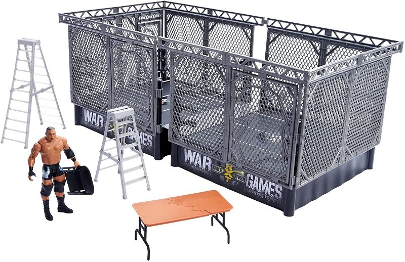 Photo 1 of ?WWE NXT Takeover War Games Playset with 2 NXT Rings, Keith Lee Action Figure, 2 Connecting Cages with Breakaway Pieces, 2 Ladders, Chair, Table & More; for Ages 6 Years Old & Up

