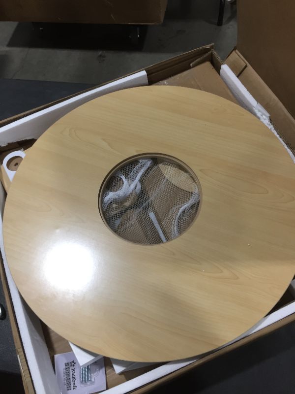 Photo 1 of KidKraft Round Table and Chair Set in White and Natural, some of the wood is stripped on the bottom of the table 