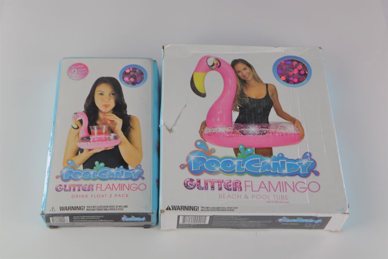 Photo 1 of POOL CANDY 36IN PINK GLITTER FLAMINGO POOL TUBE AND 2 PACK PINK GLITTER DRINK FLAMINGO FLOAT CAN FIT UP TO 16OZ NEW $55