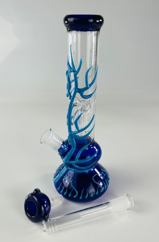 Photo 3 of FREEDOM HANDMADE WATER PIPE BLUE BASE WITH LIGHT BLUE GLOW IN THE DARK VINES INCLUDING PERCOLATORS ICE CATCHER BOWL AND STEM NEW IN BOX.
$75
