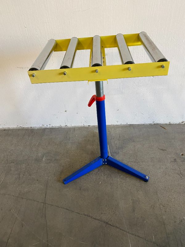 Photo 1 of BLUE RED AND YELLOW TABLE STOCK ROLLING STAND 