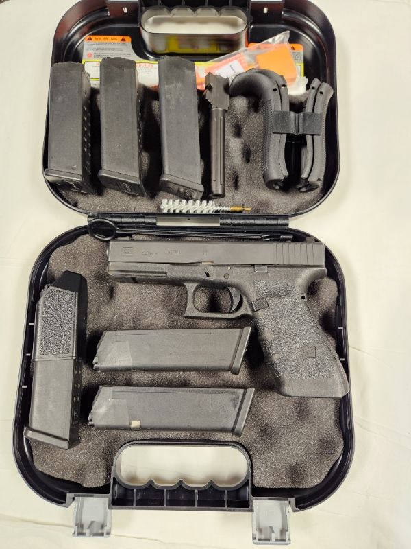 Photo 1 of Glock 22 Gen 4 .40 Caliber Pistol w/ 6 Magazines. Background Check Required. Every used firearm should be inspected by a qualified gunsmith before firing. 