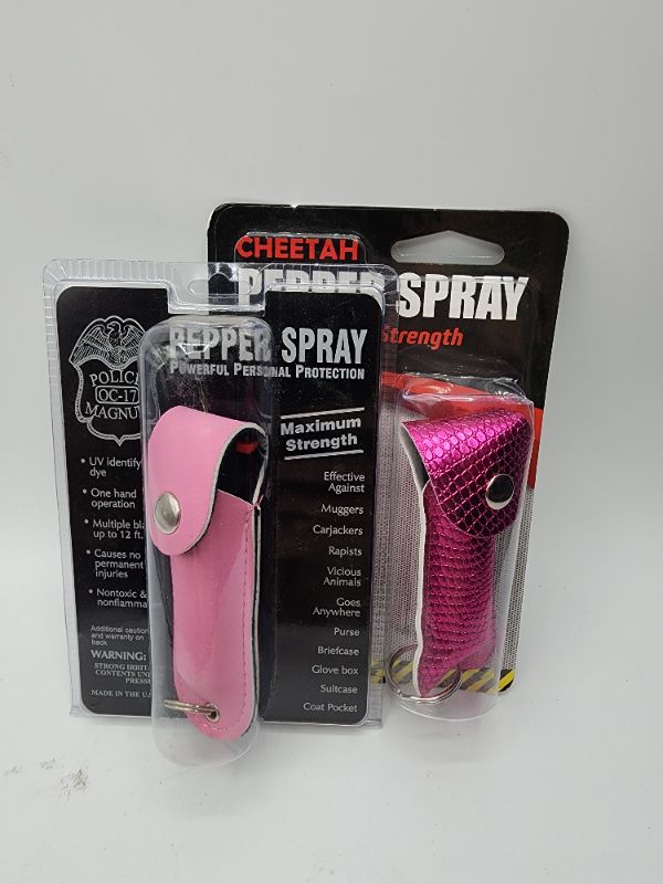Photo 1 of Pink Police Magnum Pepper Spray 1/2 oz Sprays 10-12 Feet & Pink Scale Cheetah Pepper Spray 8-12 Foot Stream