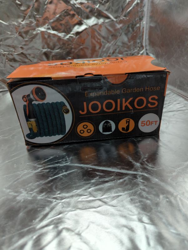 Photo 2 of JOOIKOS Expandable Garden Hose 50ft - Water Hose with 10 Functions Nozzle and Durable 3/4" Solid Brass Connectors