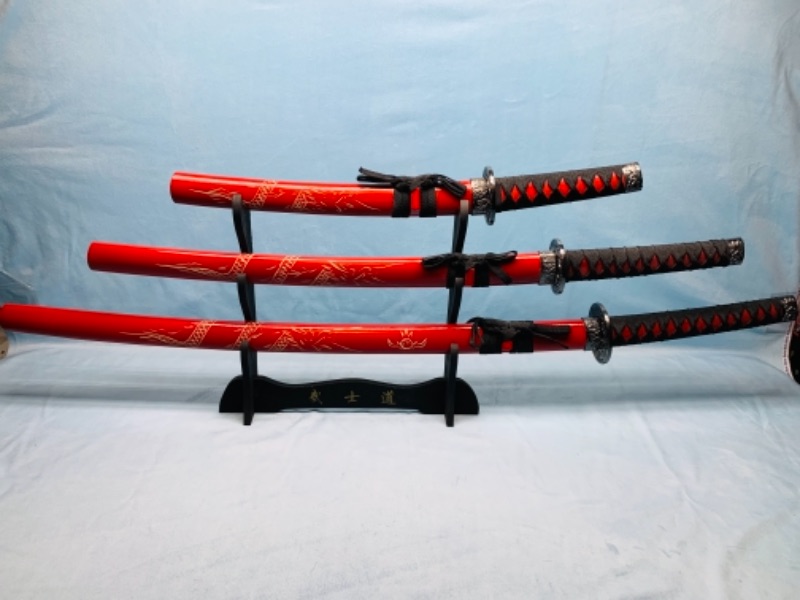 Photo 1 of Decorative display samurai swords on stand 40 -  20 inches long 