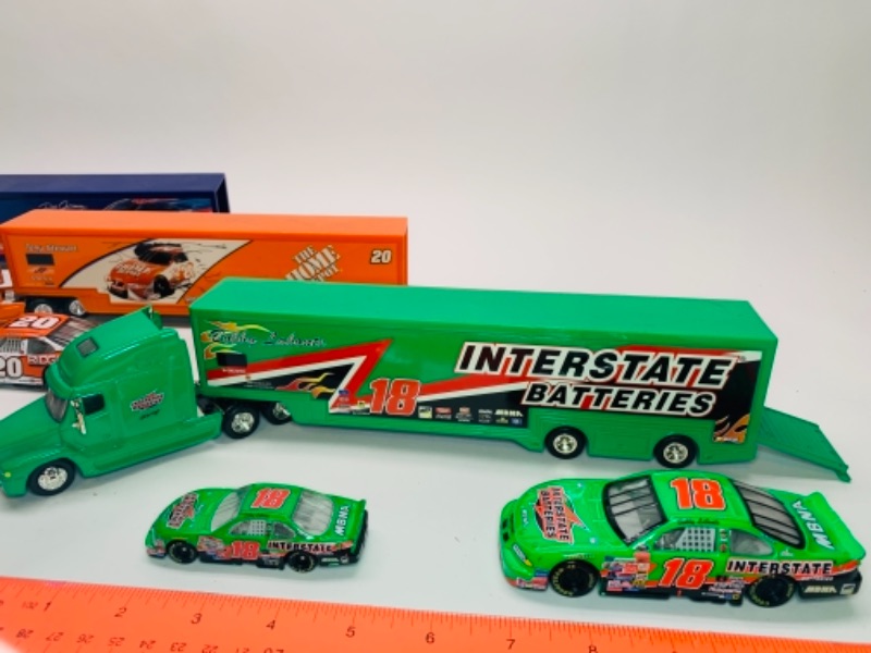 Photo 2 of 3 large die cast trucks with trailers and 4 die cast cars