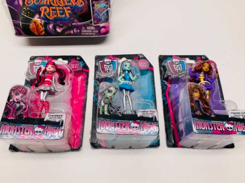 Photo 3 of Monster high dolls in packages- large package has dents