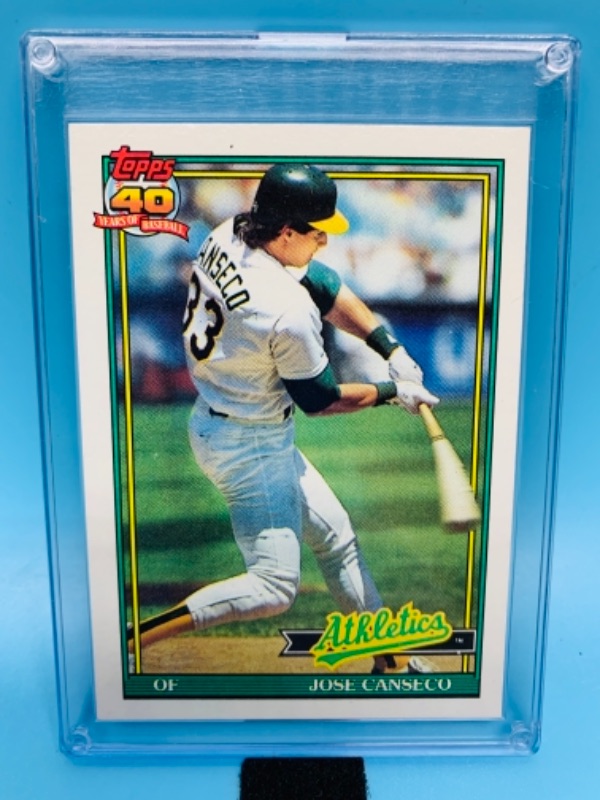 Photo 1 of 1991 topps Jose Canseco card 700 in hard plastic case